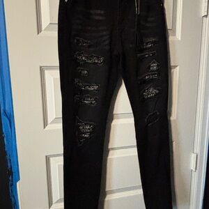 AMIRI Black Distressed Skinny Jeans